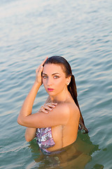 Image showing cute wet young woman in the water