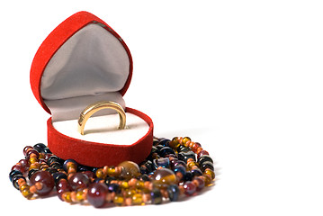 Image showing Gold ring in a red velvet box in the form of heart