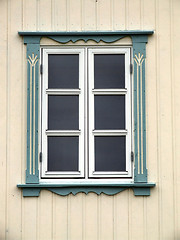 Image showing Window on a bright yellow wall