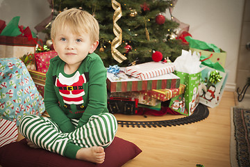 Image showing Young Boy Enjoying Christmas Morning Near The Tree