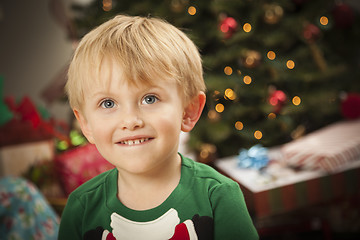 Image showing Young Boy Enjoying Christmas Morning Near The Tree