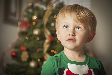 Image showing Young Boy Enjoying Christmas Morning Near The Tree