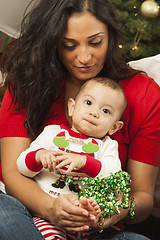 Image showing Ethnic Woman With Her Mixed Race Baby Christmas Portrait