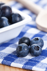 Image showing blueberries on checkered tablecloth