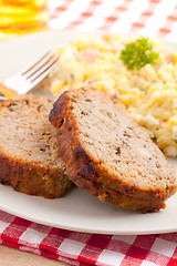 Image showing baked meatloaf with potato salad