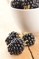 Image showing blackberries on wooden background