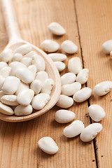 Image showing white beans in wooden spoon