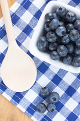 Image showing blueberries on checkered tablecloth