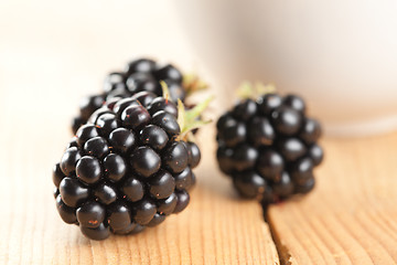 Image showing blackberries on wooden background