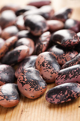 Image showing color beans on wooden table