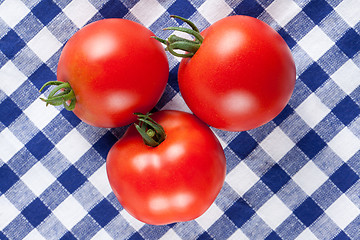 Image showing red tomatoes on table