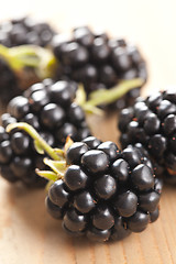 Image showing blackberries on wooden table