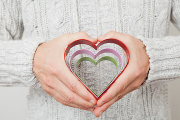 Image showing Heart symbols held in hands