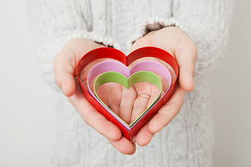 Image showing Heart symbols held in hands