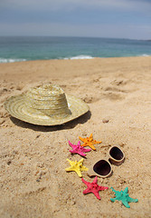 Image showing  Beach items, sand and starfishes 