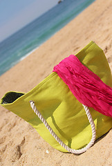 Image showing Green beach bag on the beach