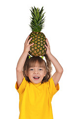 Image showing Little girl with pineapple