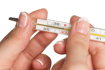 Image showing Hand with thermometer