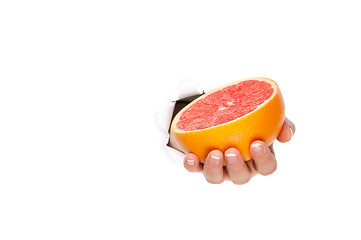 Image showing Hand with grapefruit