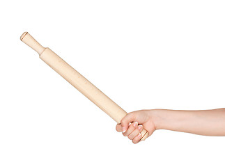 Image showing Hand with rolling pin