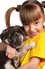 Image showing Girl with puppy