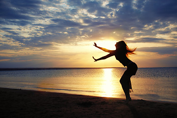 Image showing Dancing in sunset sea