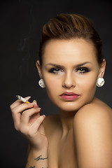 Image showing Beautiful seductive woman smoking