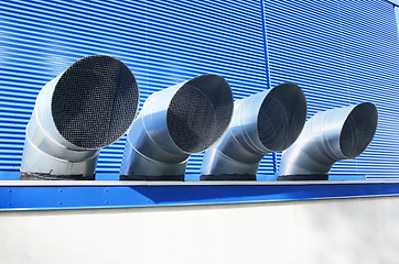 Image showing four ventilation pipes of industrial building