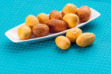 Image showing large nuts on a plate