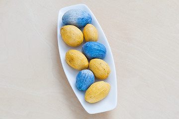 Image showing colorful decorative nuts on a plate