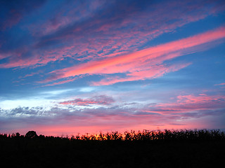 Image showing picturesque blue and scarlet clouds of sunset