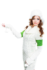 Image showing beautiful girl with winter fur cap on isolated white