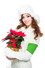 Image showing beautiful girl with red poinsettia on isolated white