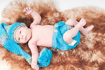 Image showing Newborn baby in long knitted hat