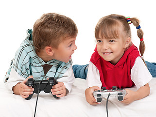 Image showing Happy girl and boy playing a video game