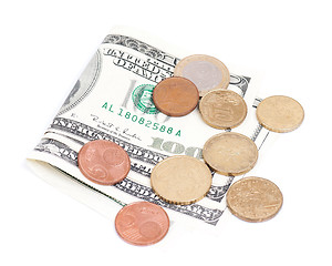 Image showing Coins over bills