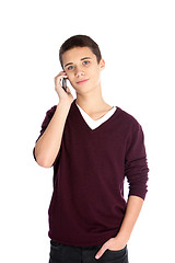 Image showing Teenage boy using a mobile phone
