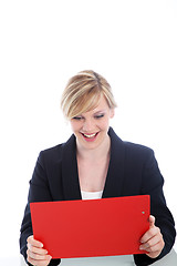 Image showing Elated woman reading notes on a clipboard