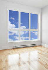 Image showing Empty room and blue sky seen through the window