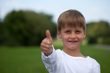 Image showing Little boy showing thumbs up