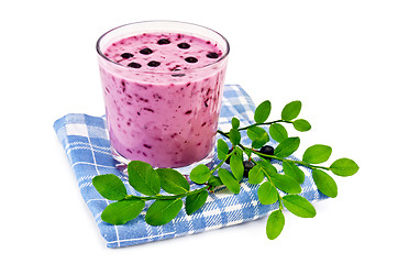 Image showing Milkshake with blueberries on a blue napkin