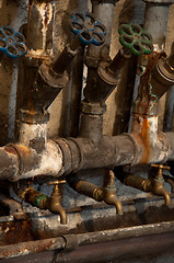 Image showing Old rusty pipes and valves