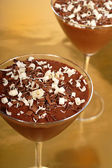 Image showing Chocolate pudding in martini glasses on a gold background