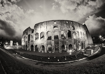 Image showing Dramatic sky above Colosseum in Rome. Night view of Flavian Amph