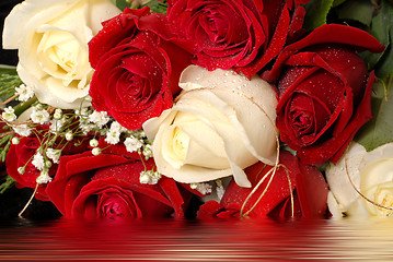 Image showing Bouquet of red and white roses in water