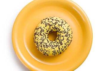 Image showing sweet doughnut on yellow plate