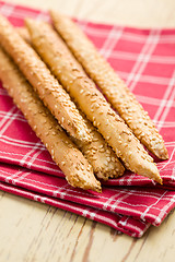 Image showing grissini sticks with sesame seeds