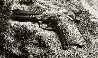 Image showing Pistol in sand