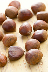 Image showing chesnuts on wooden table