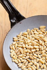 Image showing roasted pine nuts on pan